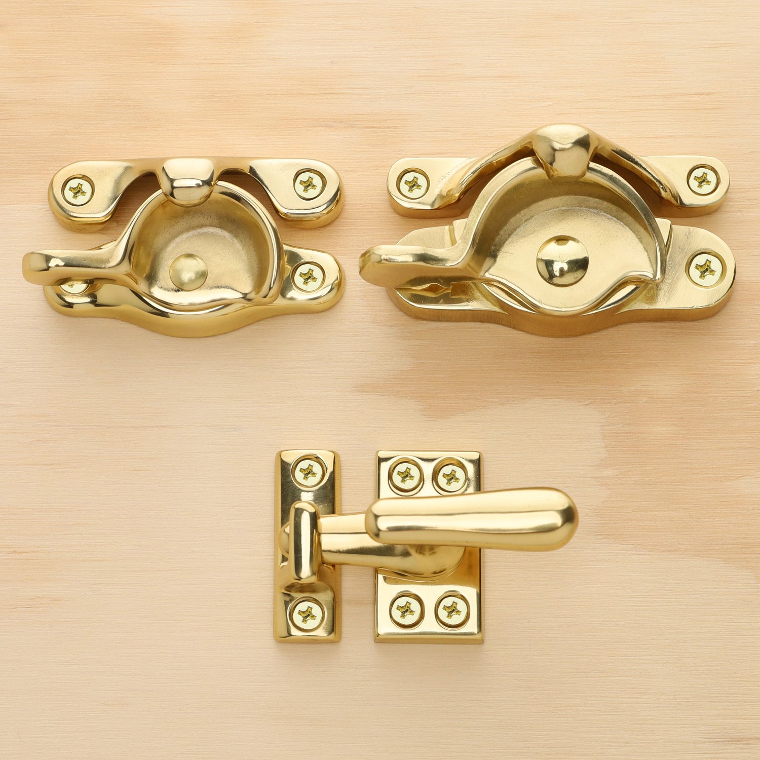 Chanson hardware solid brass window lock collection photo which shows both regular and large sash lock and small casement fastener 