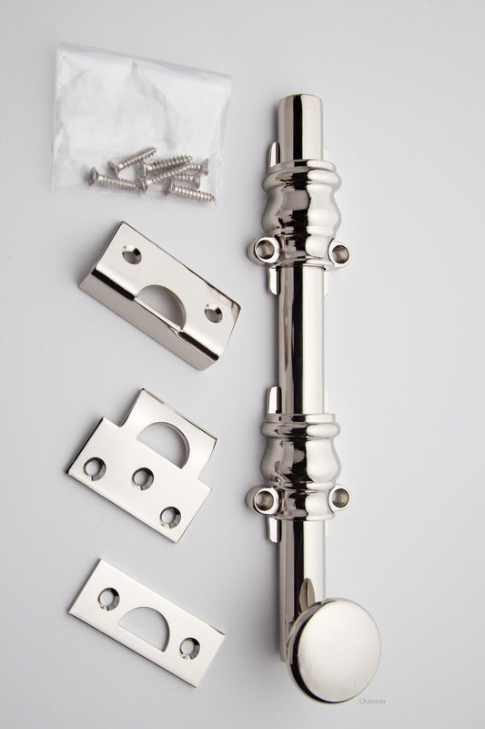 8 inch Solid Brass Surface Bolt with polished nickel finish US14 and Ornate, Ornamental, or Colonial style guides with finish matching screws along with angle, mortise, and surface strike.  All 3 strikes included.
