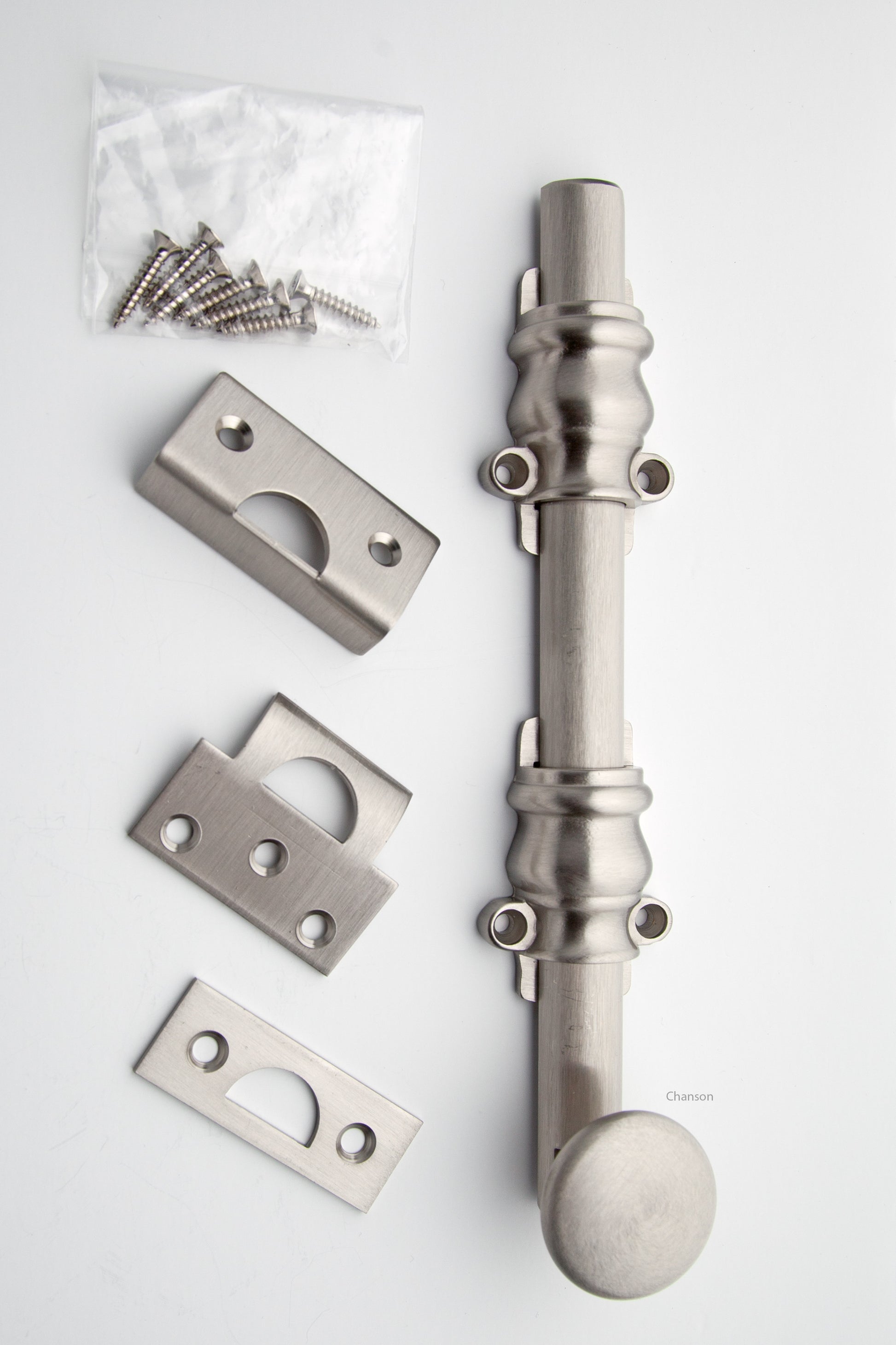 8 inch Solid Brass Surface Bolt with satin or brushed nickel finish US15 and Ornate, Ornamental, or Colonial style guides with finish matching screws along with angle, mortise, and surface strike.  All 3 strikes included.
