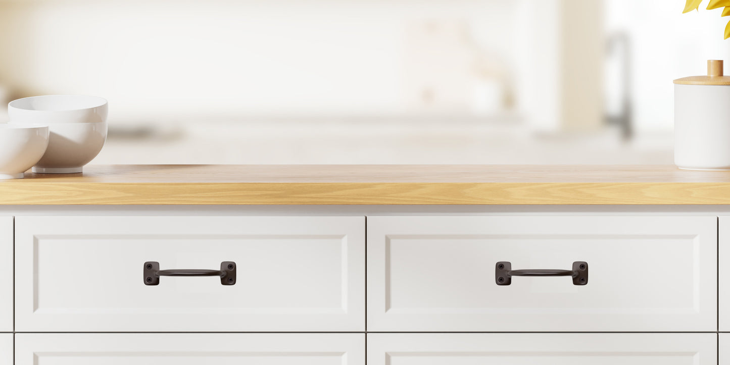 Chanson Hardware larger 4 inch center to center solid brass drawer pull shown on drawer front with oil rubbed bronze finish