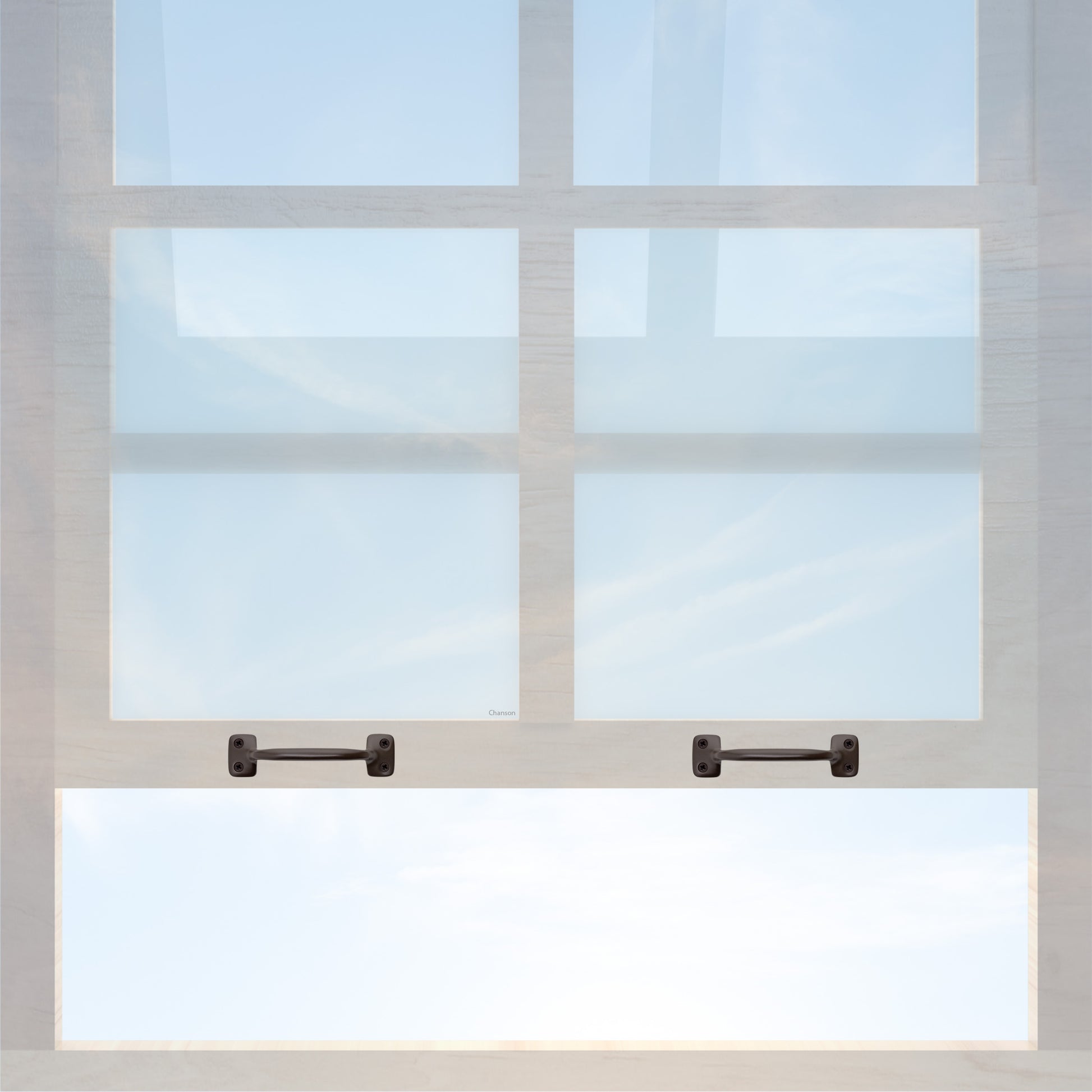 A wooden sash window with a pair of chanson hardware larger, 4 inch center to center solid brass bar type sash lifts in oil rubbed bronze finish