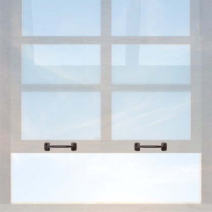 A wooden sash window with a pair of chanson hardware larger, 4 inch center to center solid brass bar type sash lifts in oil rubbed bronze finish