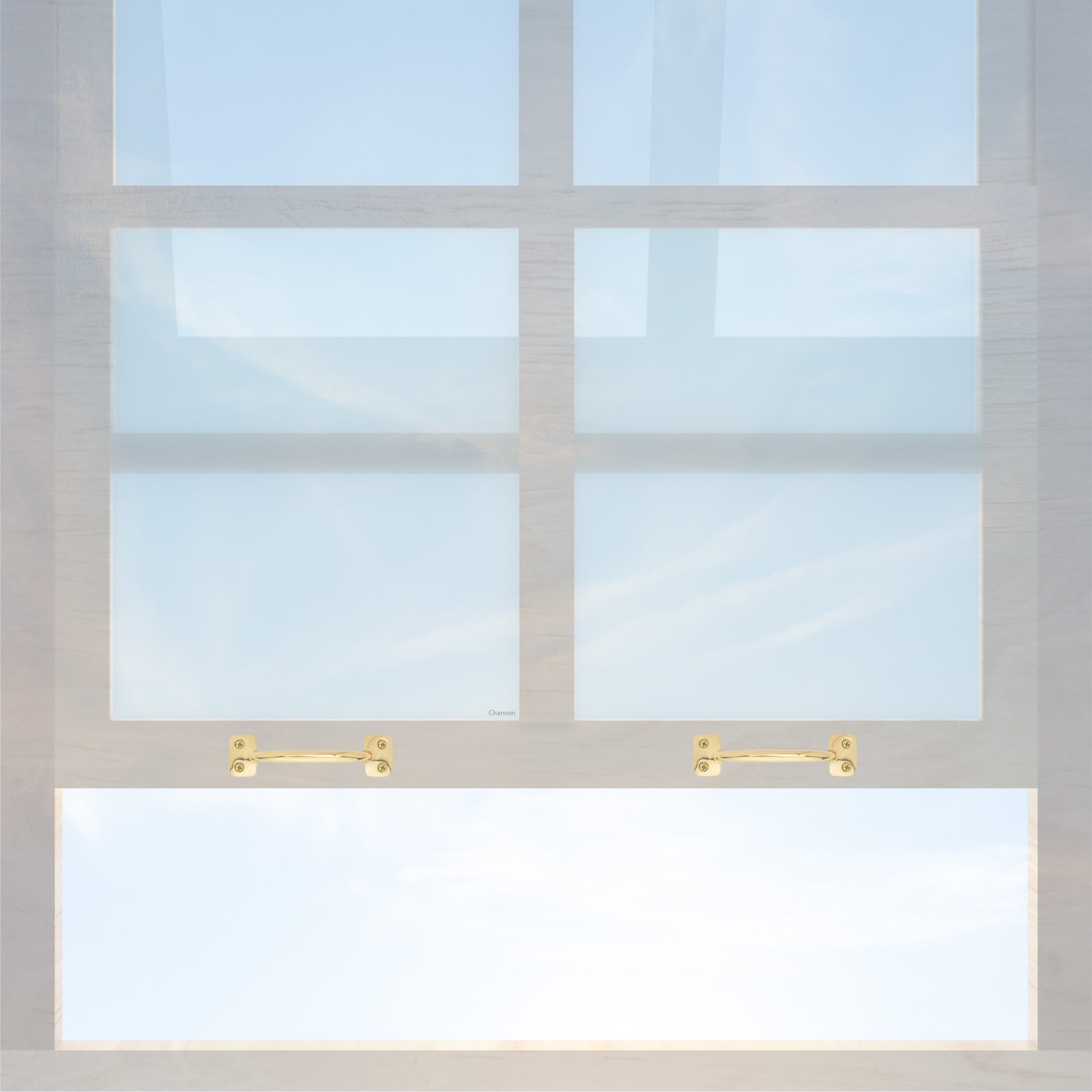A wooden sash window with a pair of chanson hardware larger, 4 inch center to center solid brass bar type sash lifts in unlacquered brass