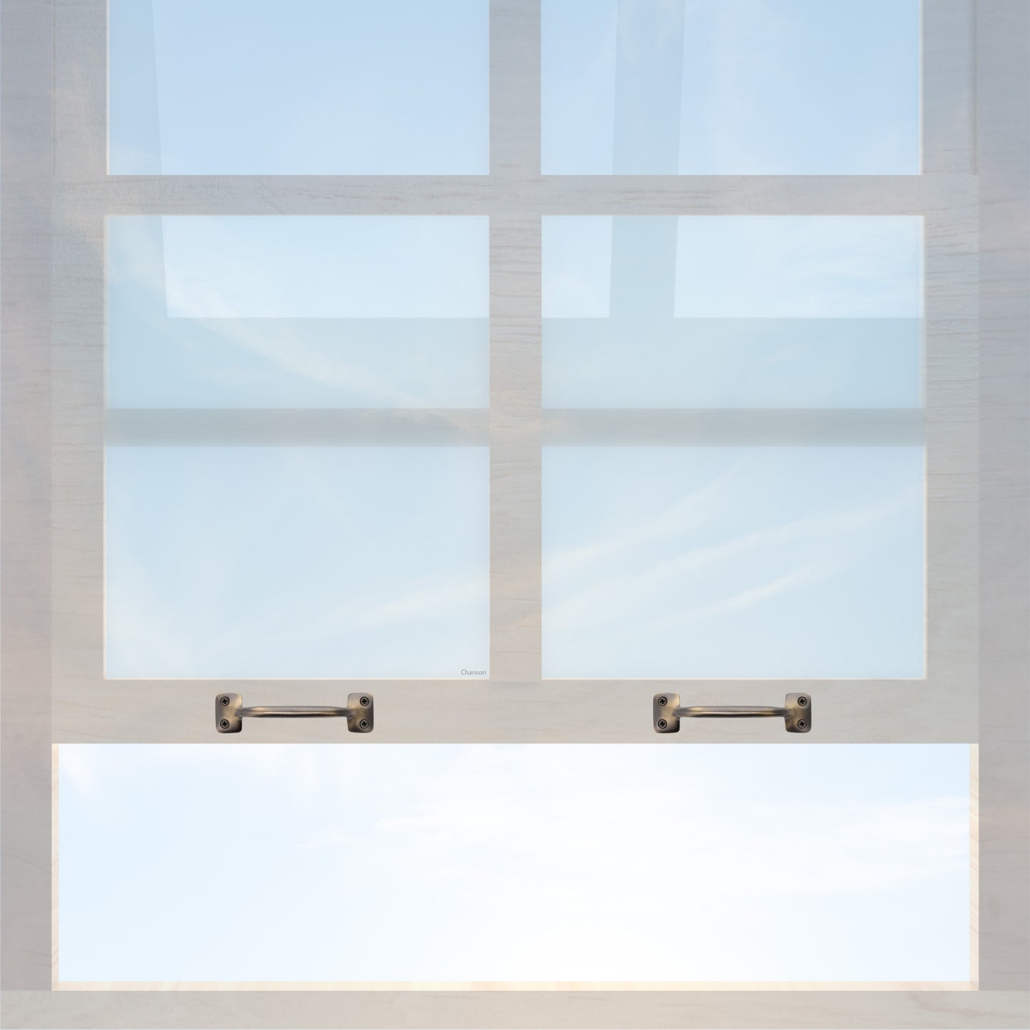A wooden sash window with a pair of chanson hardware larger, 4 inch center to center solid brass bar type sash lifts in antique brass finish
