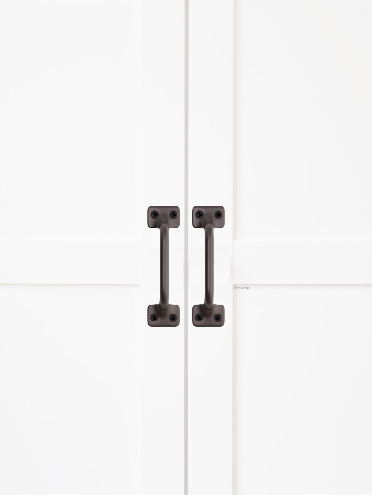 Chanson Hardware solid brass door pull shown on cabinet door in oil rubbed bronze finish