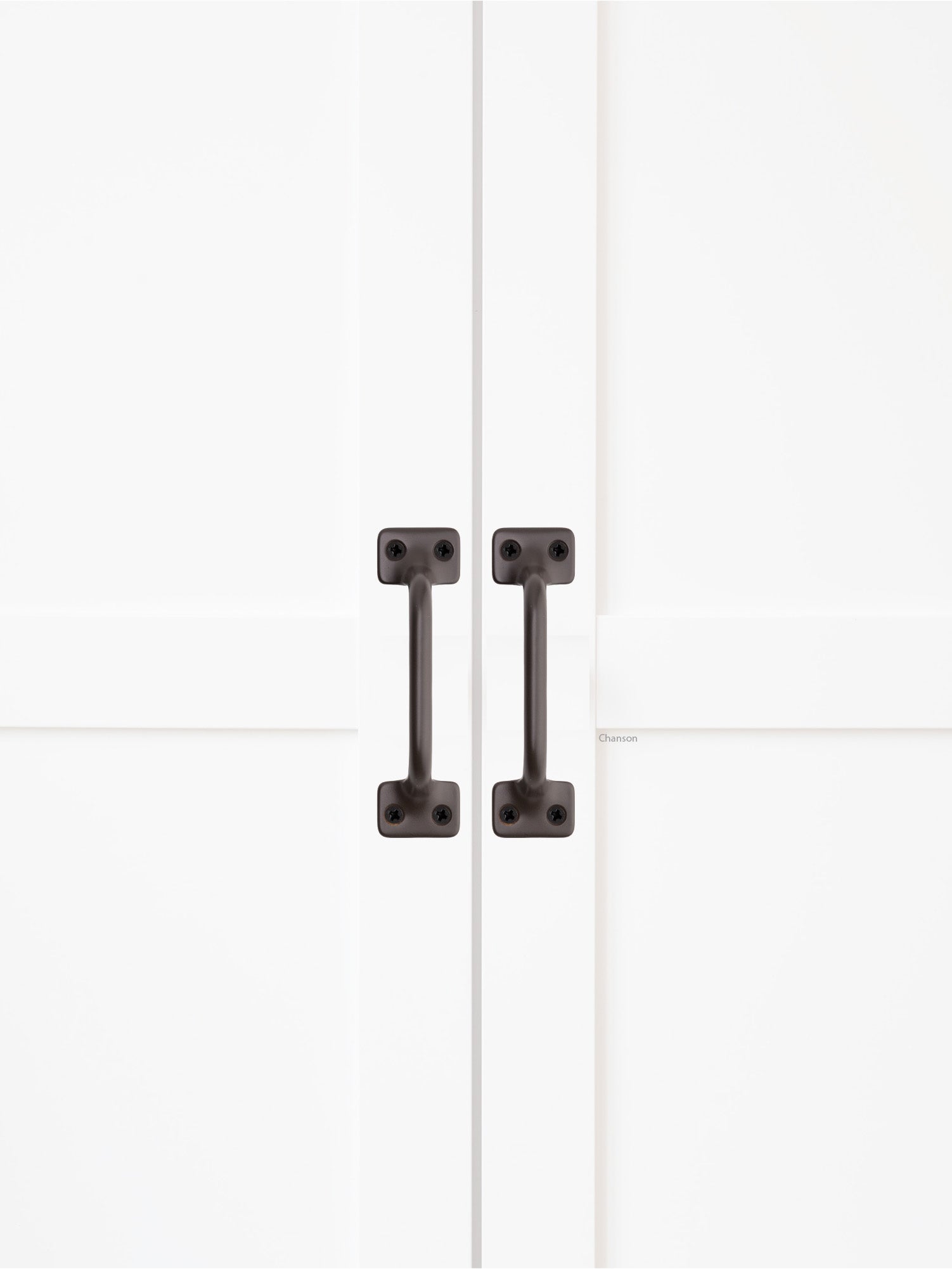 Chanson Hardware solid brass door pull shown on cabinet door in oil rubbed bronze finish