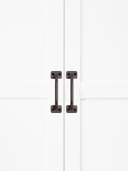 Chanson Hardware solid brass door pull shown on cabinet door in oil rubbed bronze finish