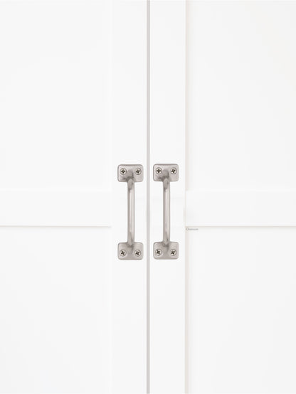 Chanson Hardware solid brass door pull shown on cabinet door in satin brass finish