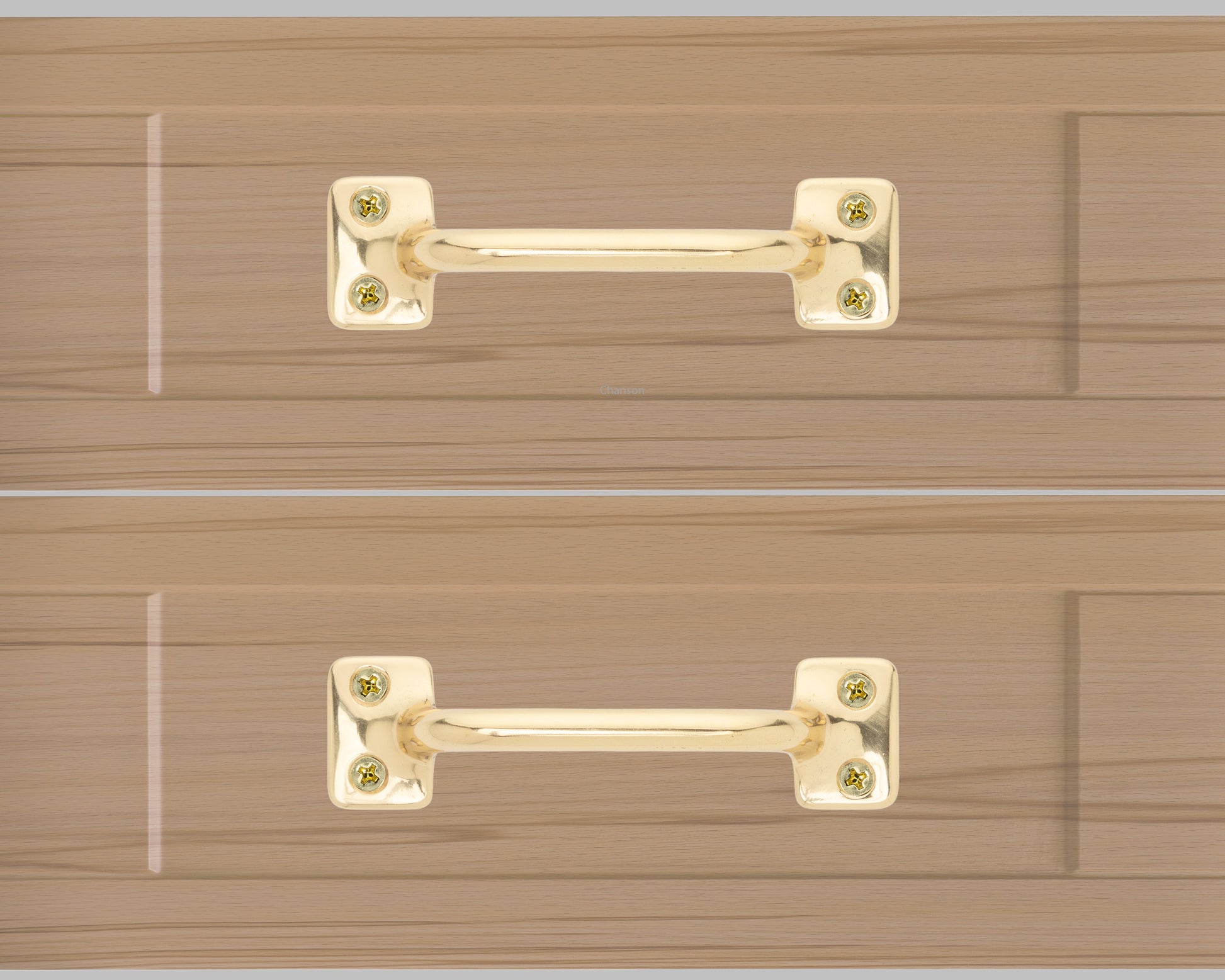 Chanson hardware solid brass drawer pull shown on drawer face with polished brass finish