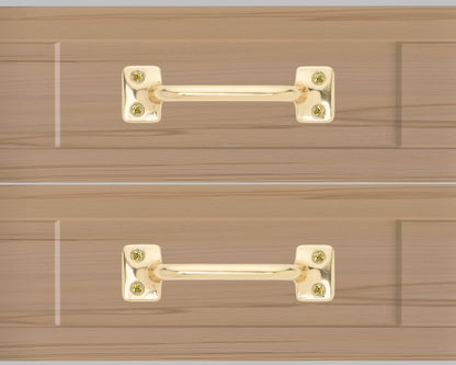 Chanson hardware solid brass drawer pull shown on drawer face with polished brass finish