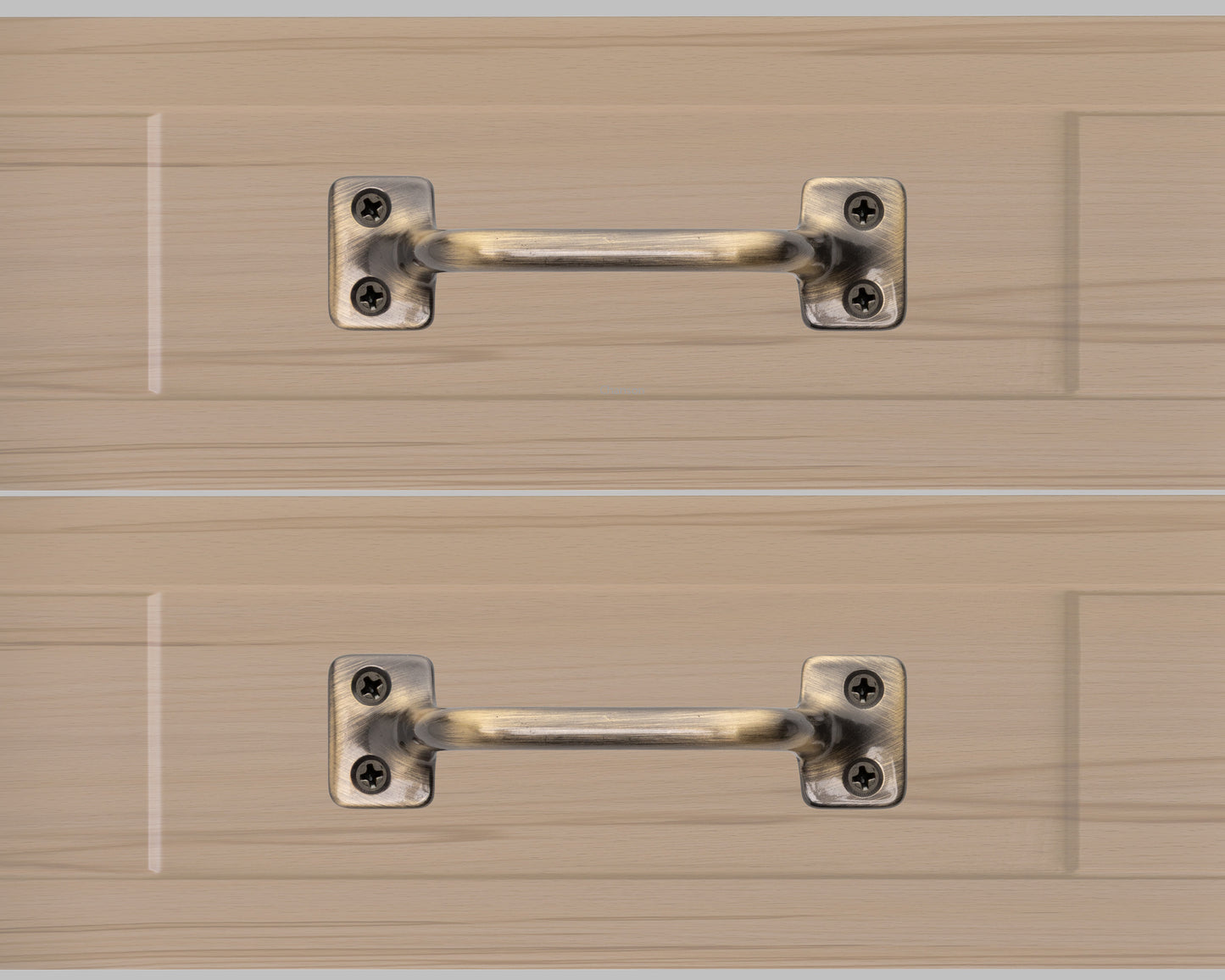 Chanson hardware solid brass drawer pull shown on drawer face with antique brass finish