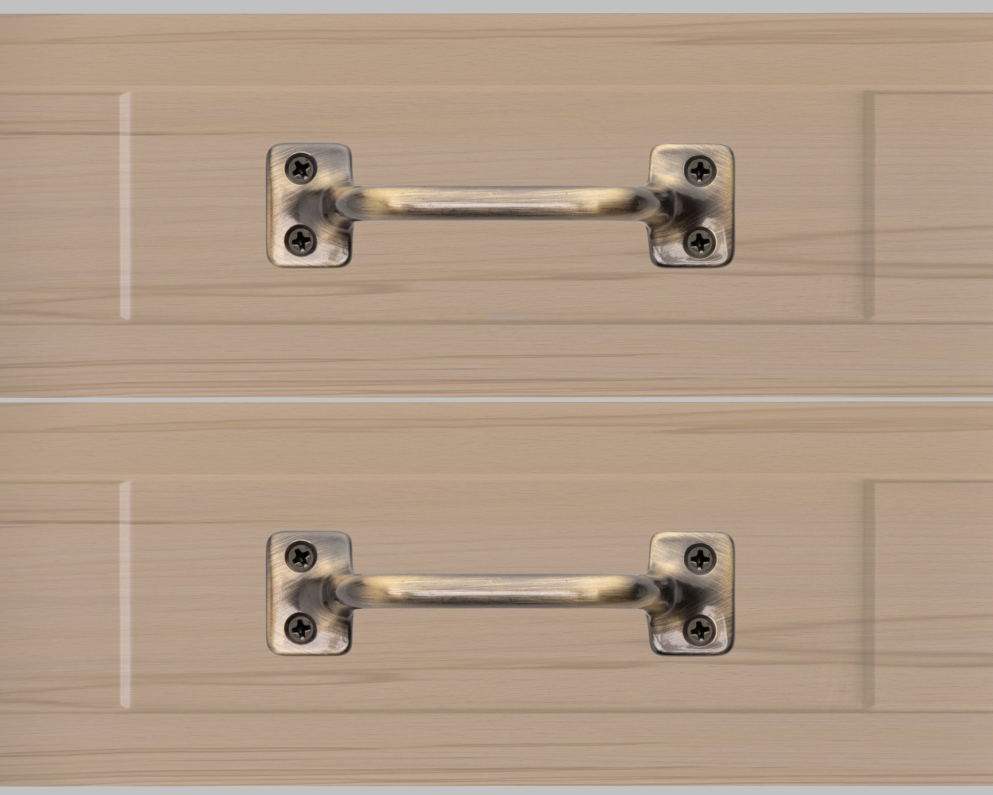 Chanson hardware solid brass drawer pull shown on drawer face with antique brass finish