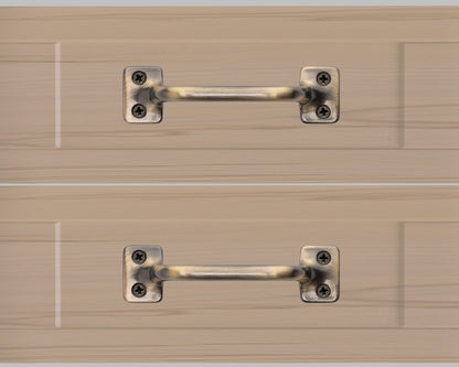 Chanson hardware solid brass drawer pull shown on drawer face with antique brass finish