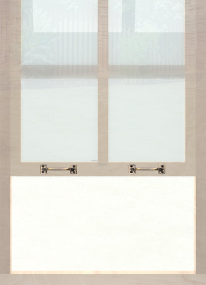 A wooden sash window with a pair of chanson hardware solid brass bar type sash lifts in antique brass finish