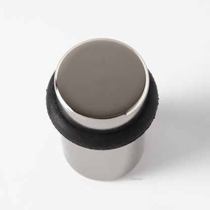 Top view of flat top solid brass cylindrical round floor doorstop in polished nickel finish US14