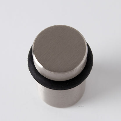 Top view of flat top solid brass cylindrical round floor doorstop in satin or brushed nickel finish US15
