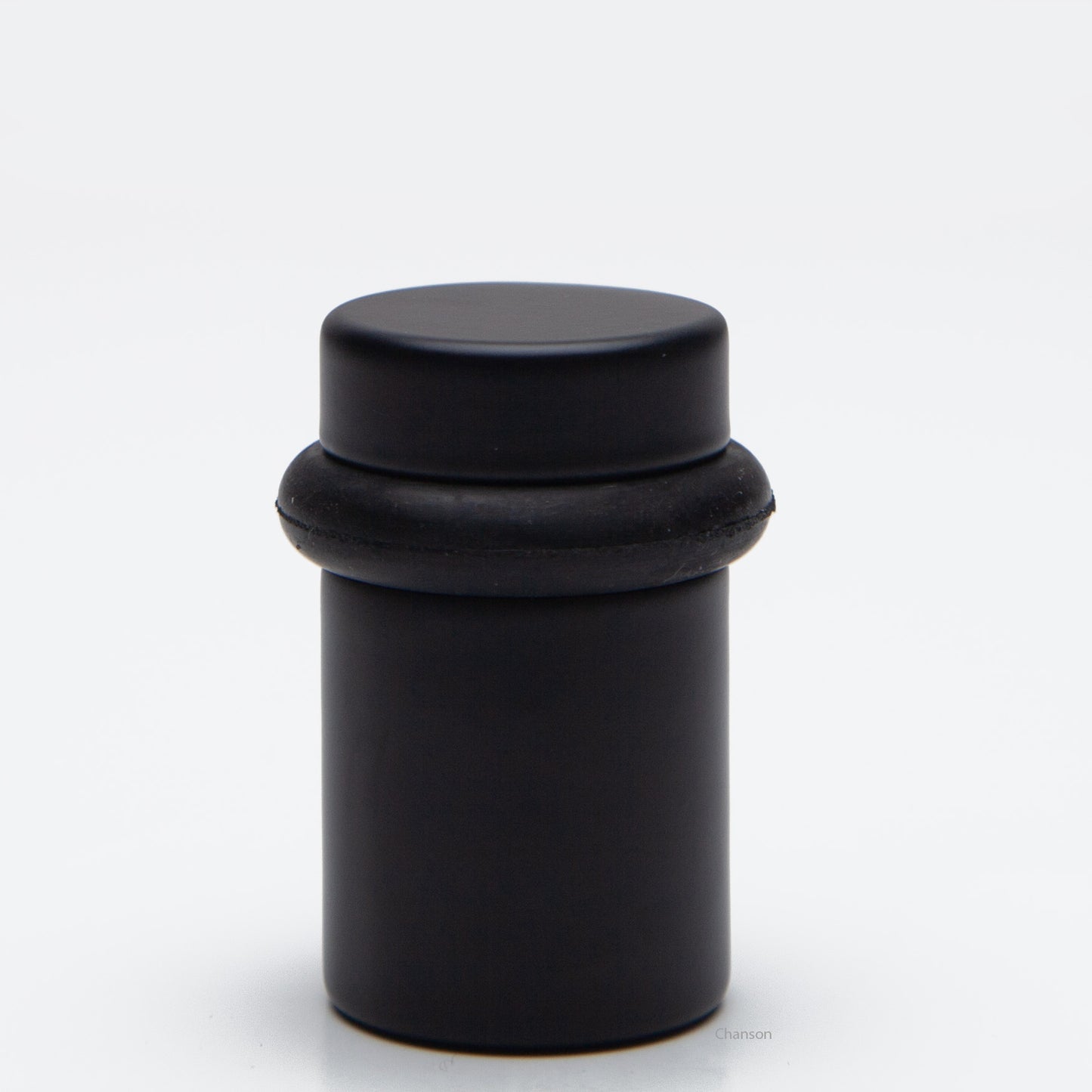 2 inch tall solid brass cylindrical shaped simple universal doorstop or floor bumper in flat or matte black finish US19
