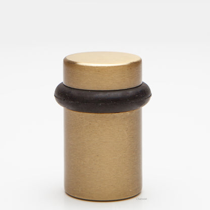 2 inch tall solid brass cylindrical shaped simple universal doorstop or floor bumper in satin brass finish US4