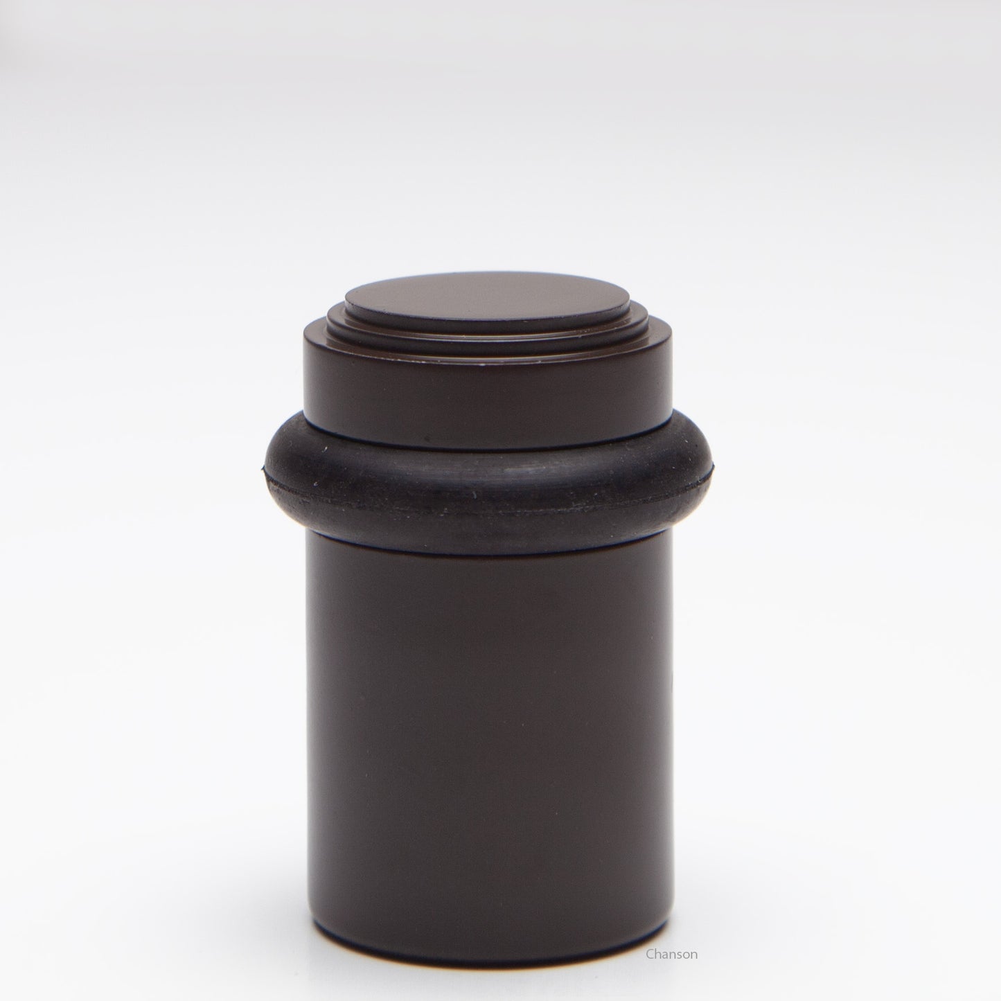 2 inch solid brass decorative floor doorstop or bumper with stepped top and cylindrical top in oil rubbed bronze US10B finish. Art Deco inspired