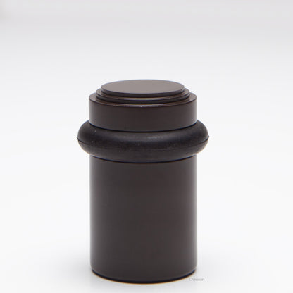 2 inch solid brass decorative floor doorstop or bumper with stepped top and cylindrical top in oil rubbed bronze US10B finish. Art Deco inspired