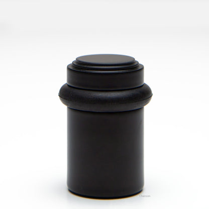 2 inch solid brass decorative floor doorstop or bumper with stepped top and cylindrical top in flat or matte black US19 finish. Art Deco inspired