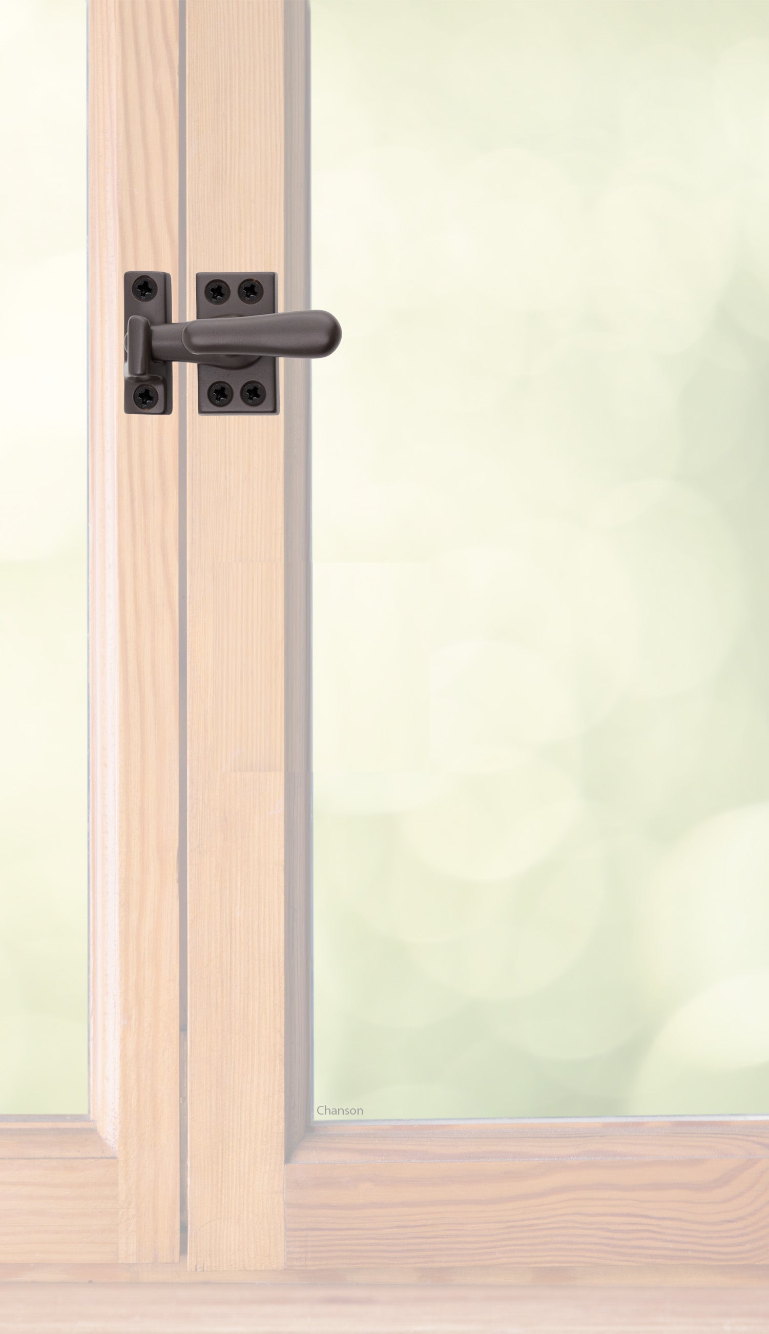 Traditional style solid brass casement fastener or window latch with a surface strike installed on a wooden swinging window, shown with oil rubbed bronze finish