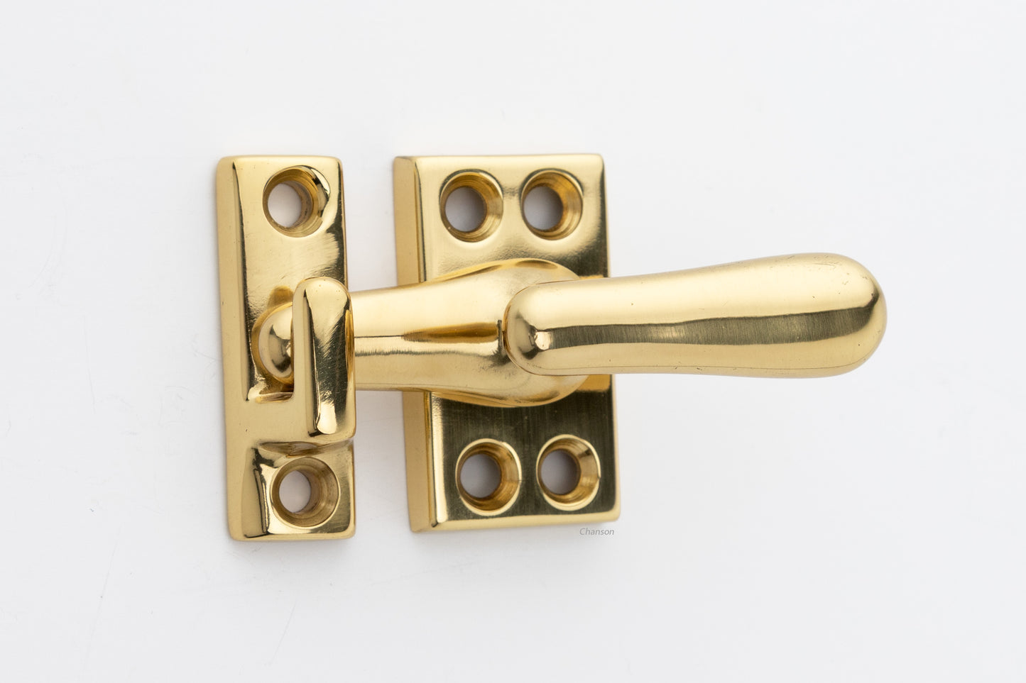 Forged solid brass casement fastener latch unit engaged with surface strike in polished brass finish US3