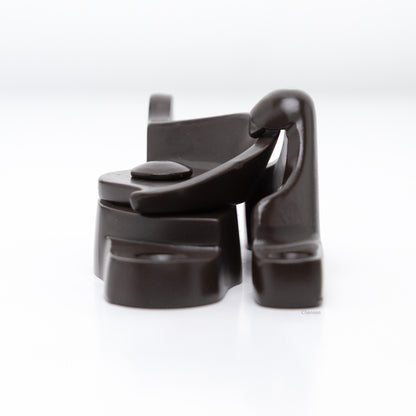 Side view of  large size solid brass sash catch, which shows latch engaging with hook strike or keeper. finish is oil rubbed bronze US10B