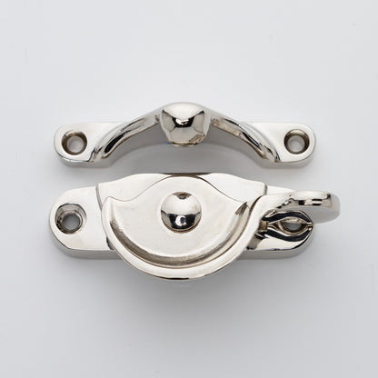 Classic style  large solid brass sash catch shown with lock turned open. Showcases hook shaped keeper and crescent shaped latch in polished nickel US14 finish