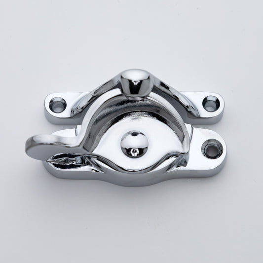 Classic or traditional large solid brass sash catch or sash window lock with hook style keeper and crescent shape in polished chrome US26 finish