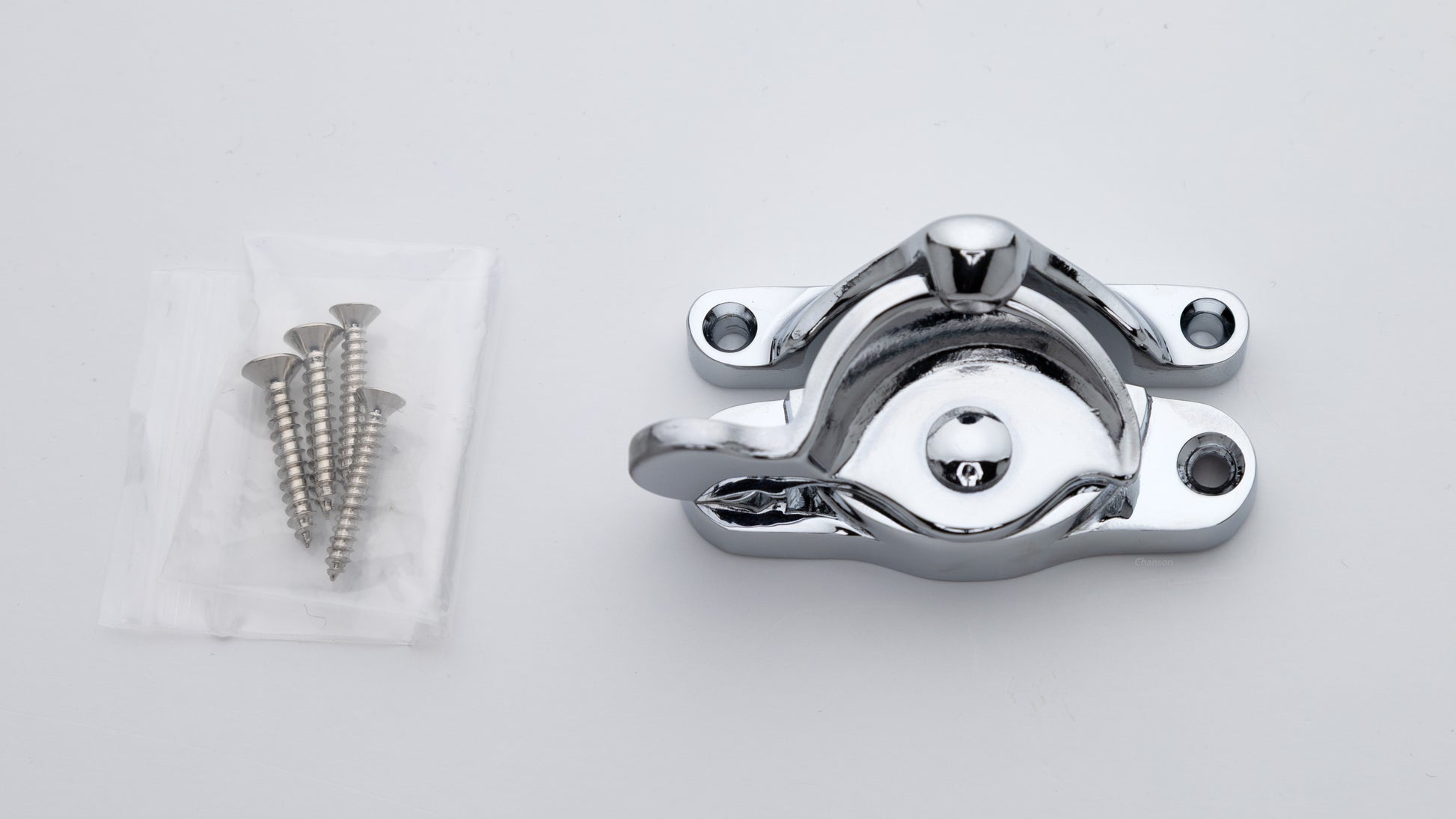 large sized Solid brass sash window catch, regular size with finish matching screws in polished chrome US26 finish