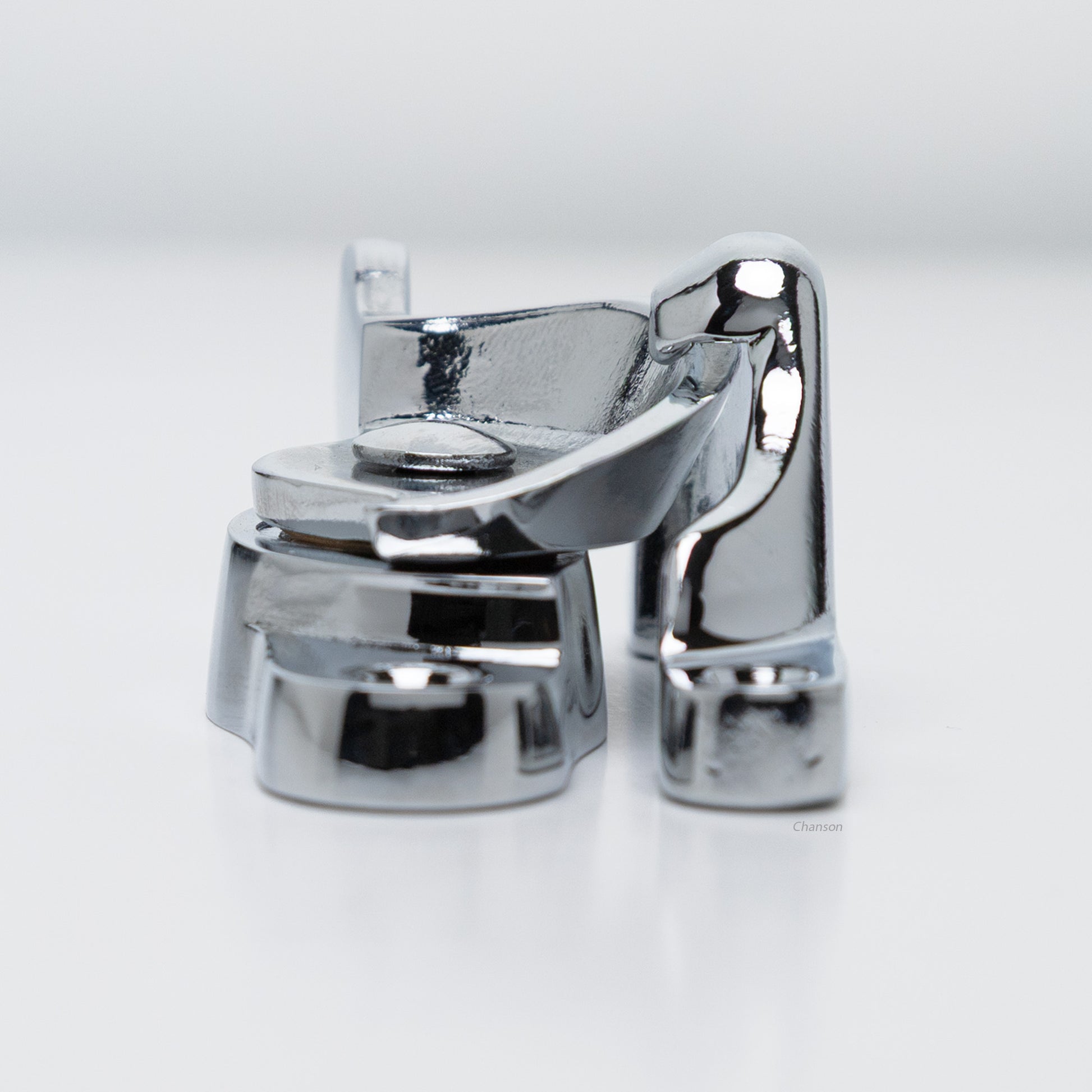 Side view of  large size solid brass sash catch, which shows latch engaging with hook strike or keeper. finish is polished chrome US26