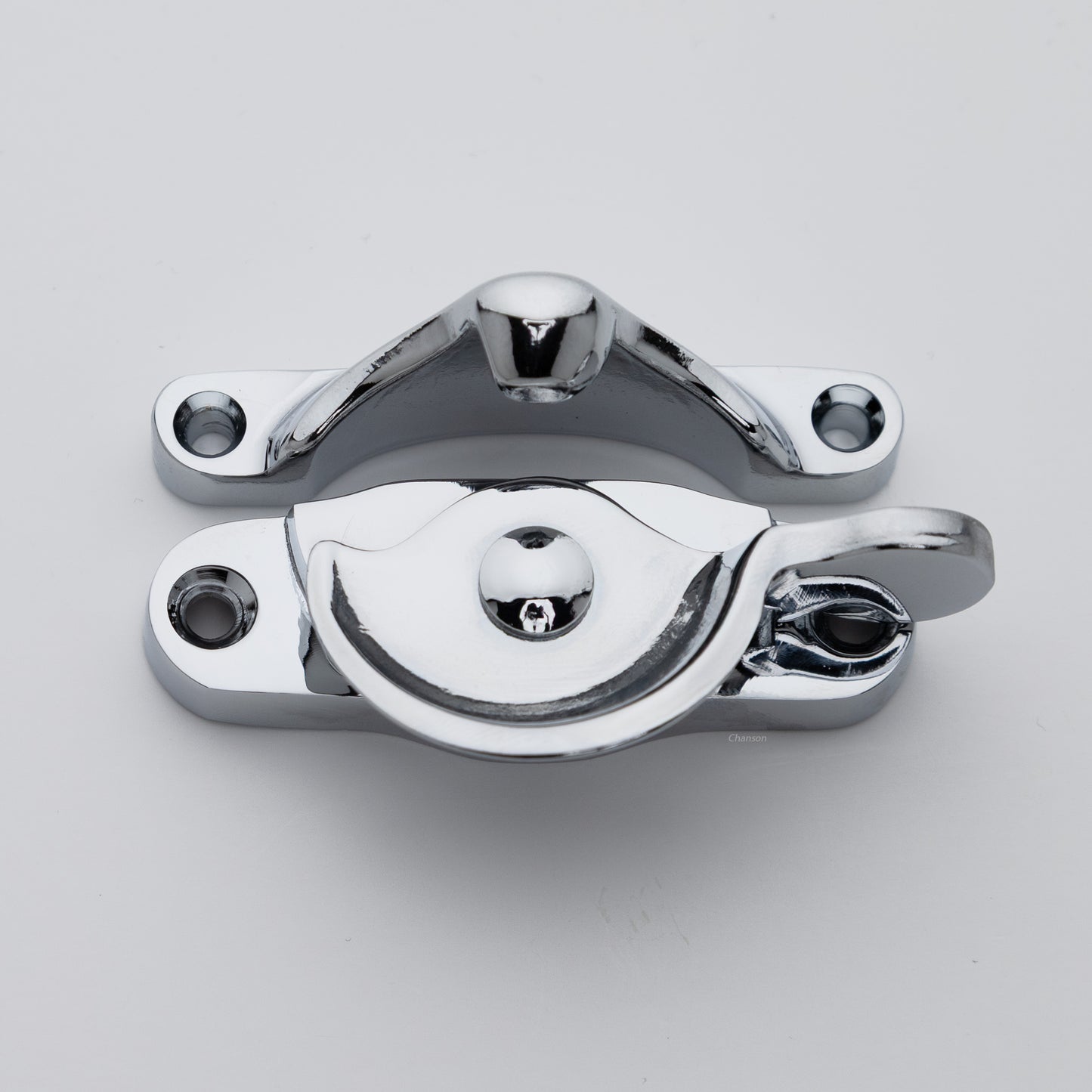 Classic style  large solid brass sash catch shown with lock turned open. Showcases hook shaped keeper and crescent shaped latch in polished chrome US26 finish
