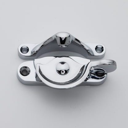 Classic style  large solid brass sash catch shown with lock turned open. Showcases hook shaped keeper and crescent shaped latch in polished chrome US26 finish