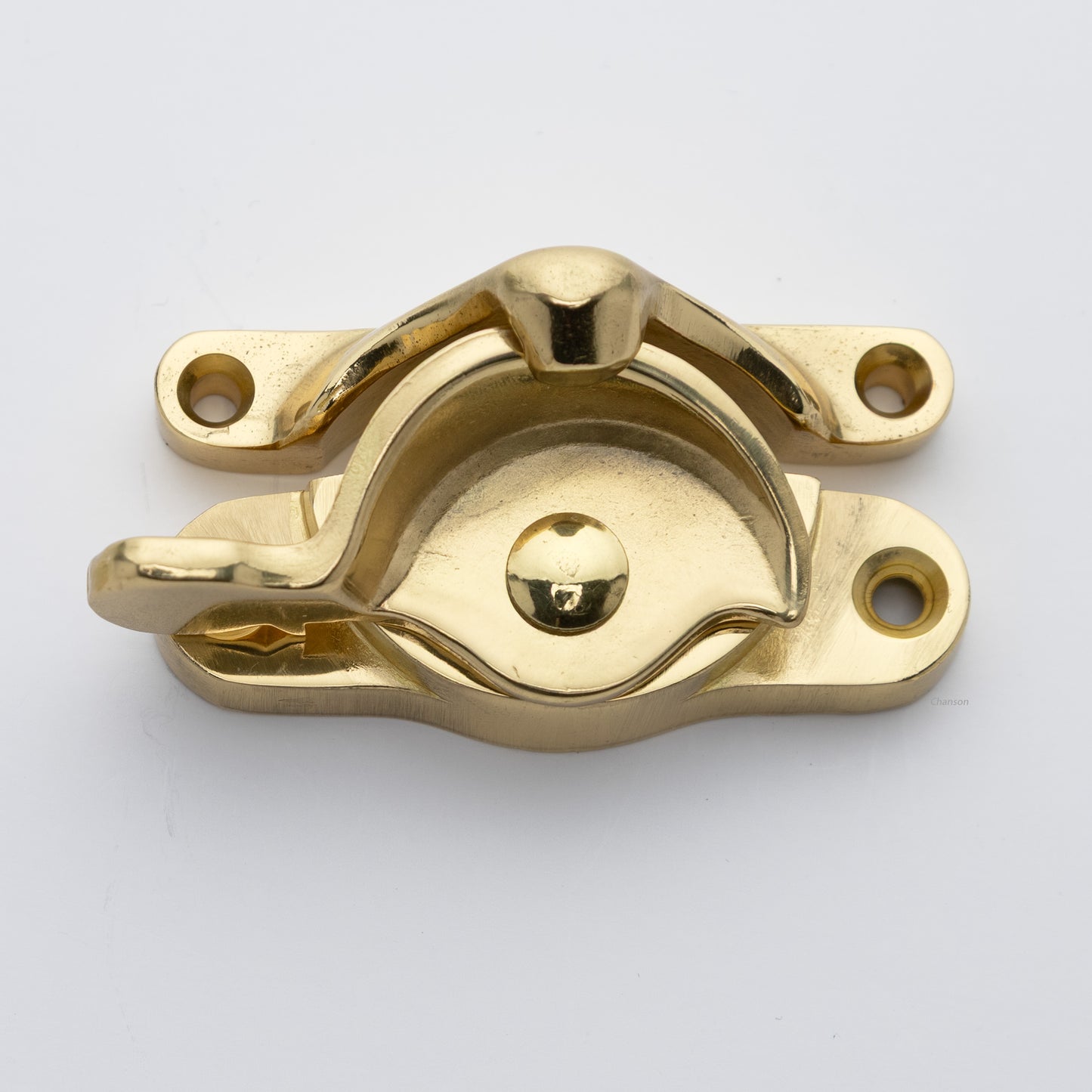 Classic or traditional large solid brass sash catch or sash window lock with hook style keeper and crescent shape in unlacquered brass US3NL finish