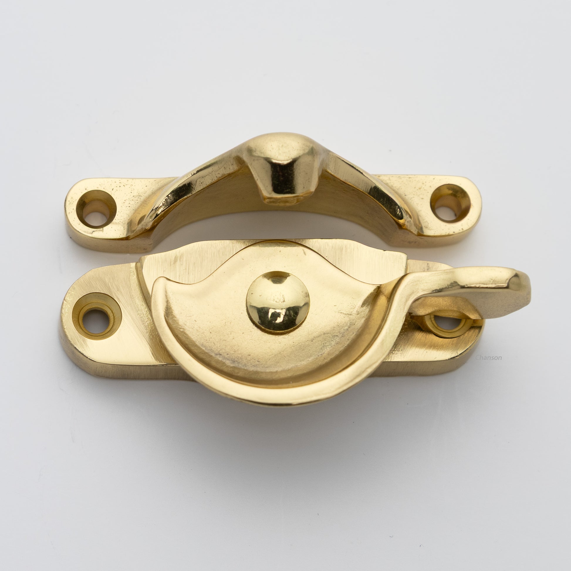 Classic style  large solid brass sash catch shown with lock turned open. Showcases hook shaped keeper and crescent shaped latch in unlacquered brass US3NL finish