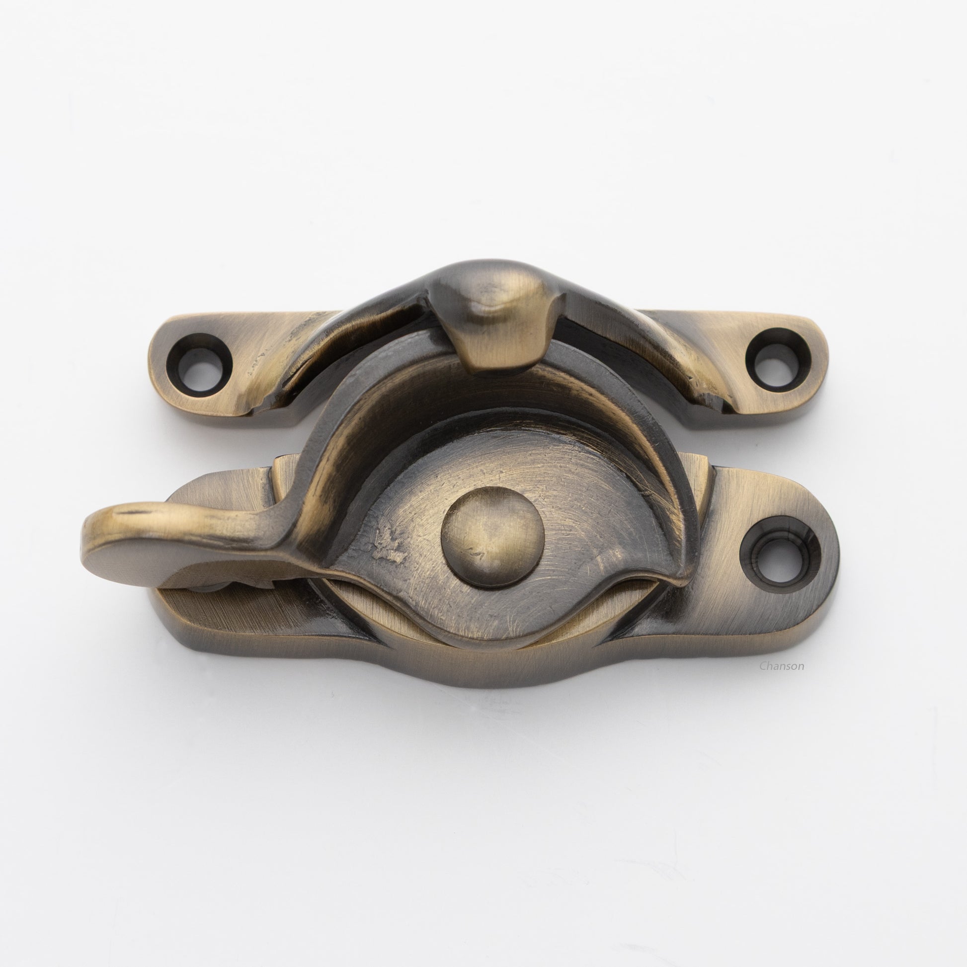 Classic or traditional large solid brass sash catch or sash window lock with hook style keeper and crescent shape in antique brass US5 finish