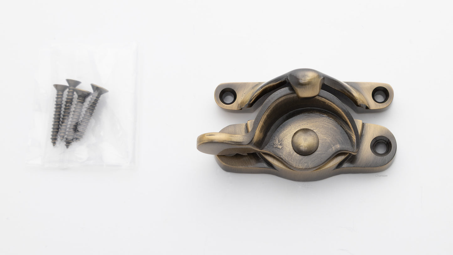 large sized Solid brass sash window catch, regular size with finish matching screws in antique brass US5 finish