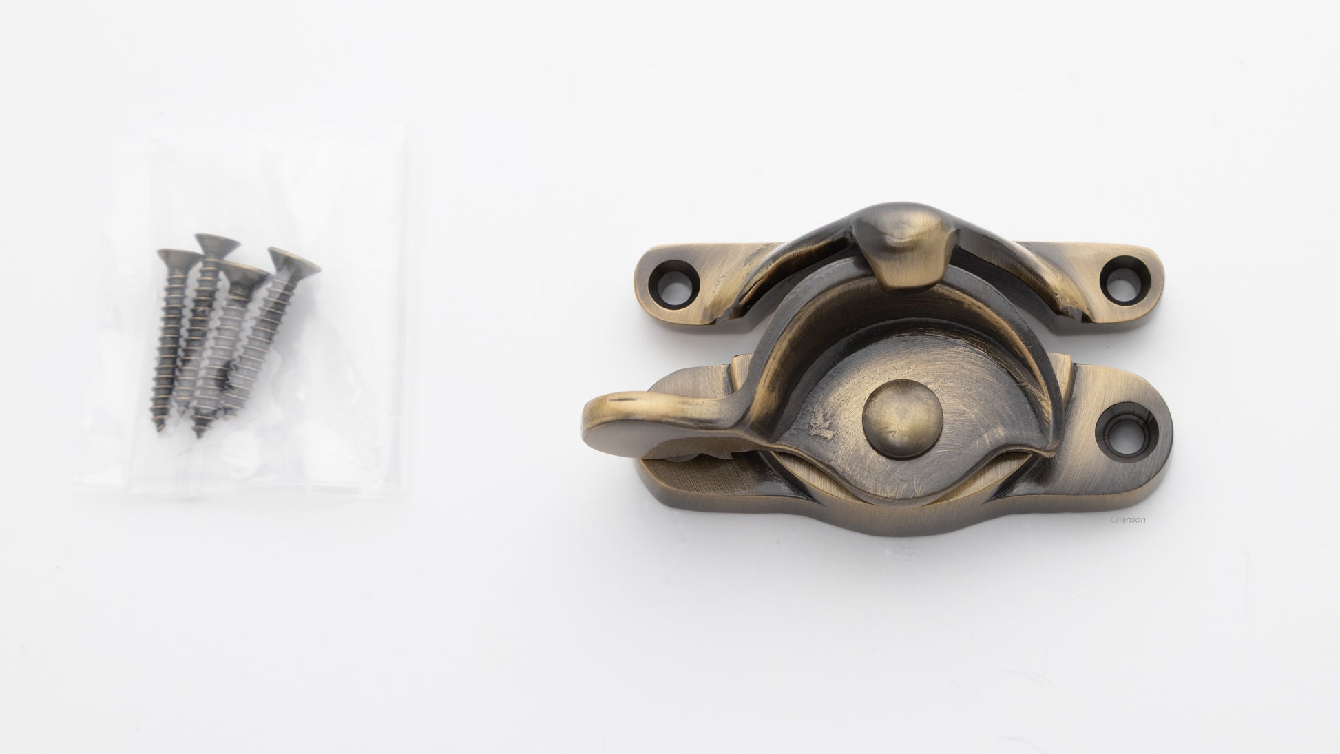 large sized Solid brass sash window catch, regular size with finish matching screws in antique brass US5 finish