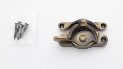 large sized Solid brass sash window catch, regular size with finish matching screws in antique brass US5 finish