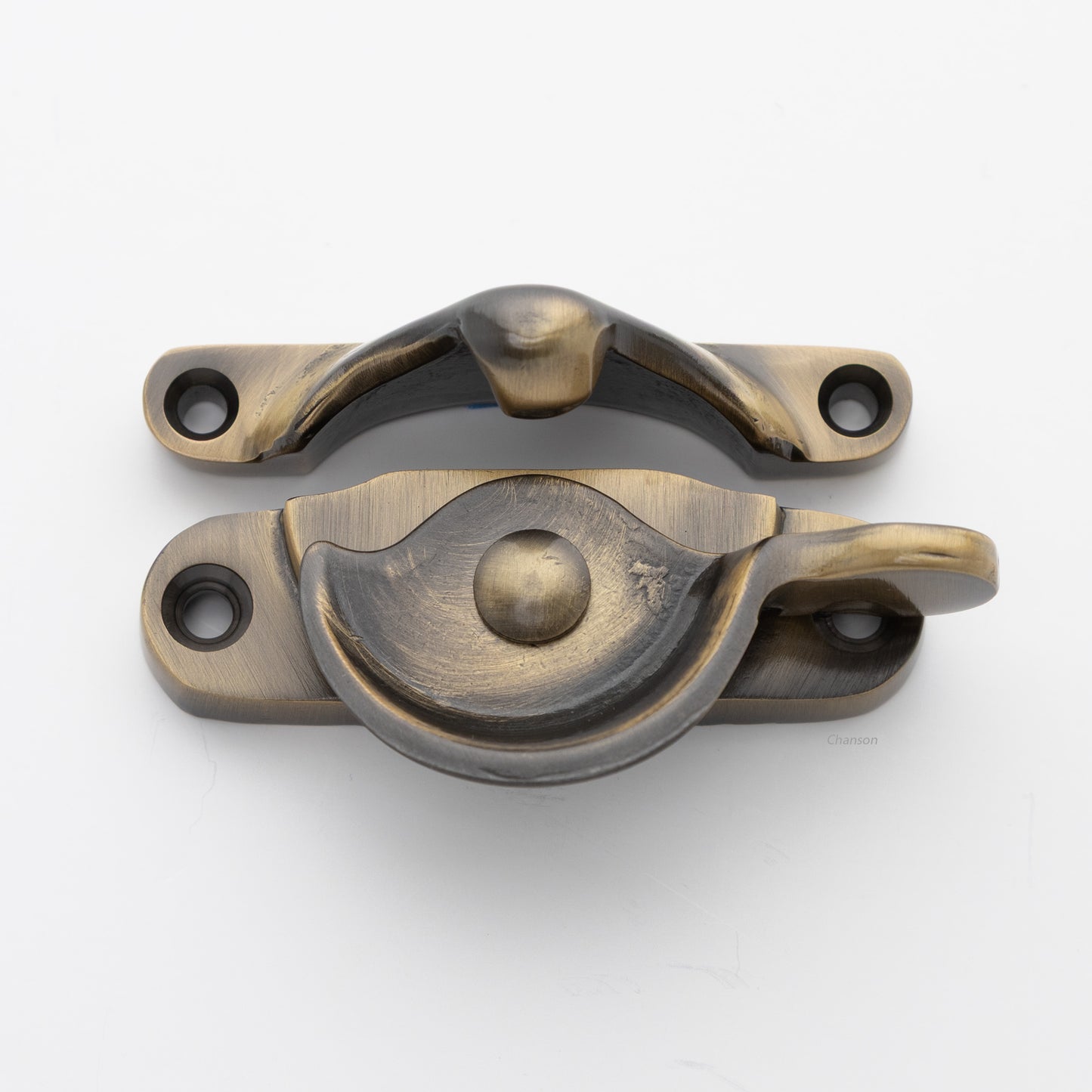 Classic style  large solid brass sash catch shown with lock turned open. Showcases hook shaped keeper and crescent shaped latch in antique brass US5 finish