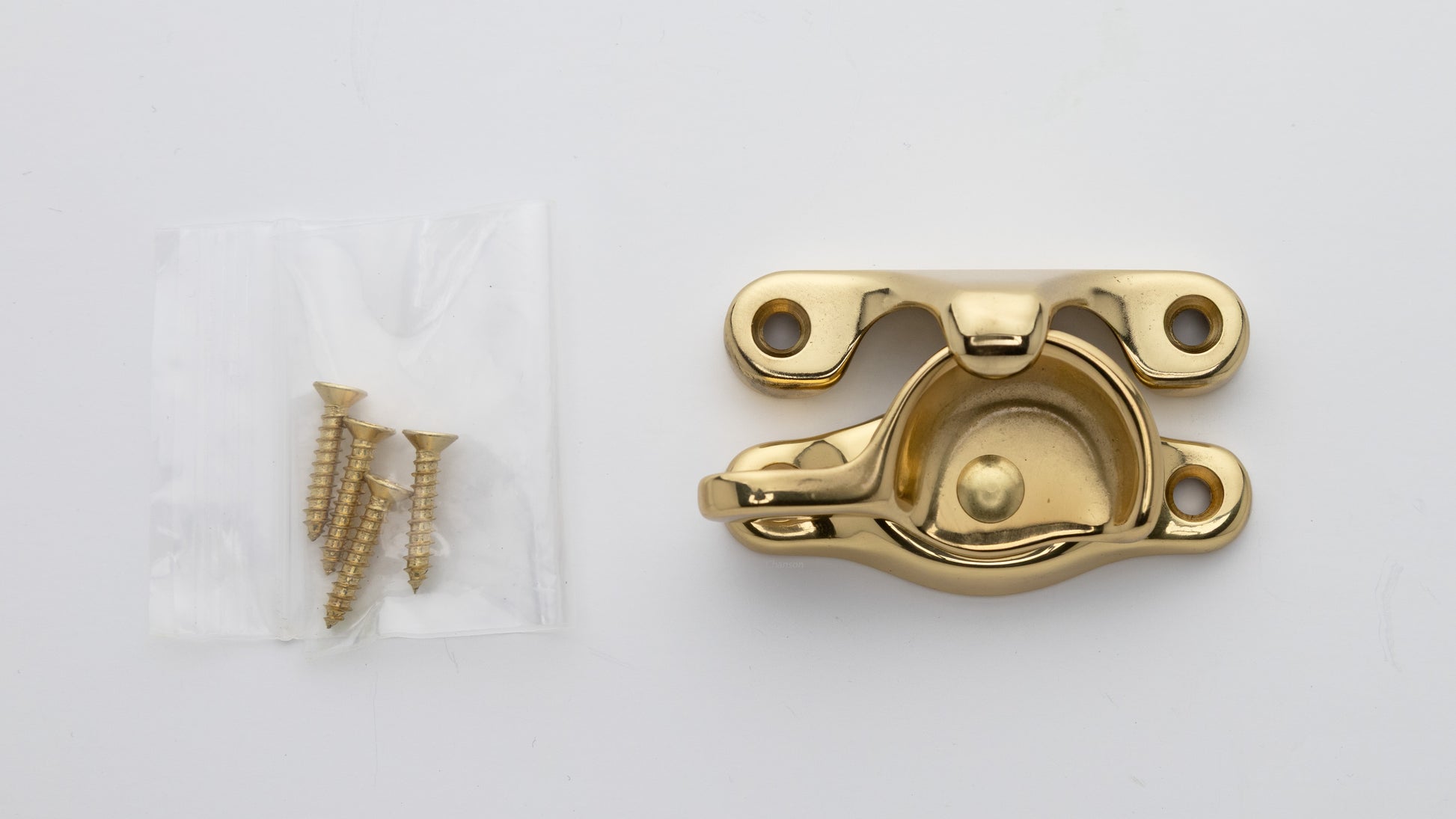 Solid brass sash window catch, regular size with finish matching screws in polished brass US3 finish