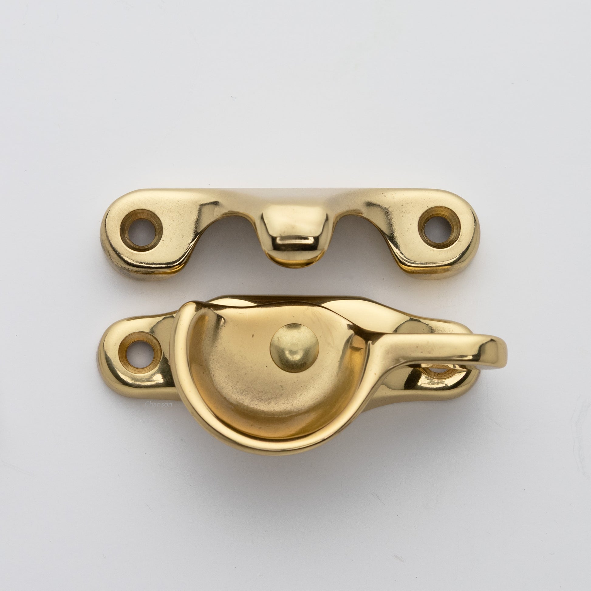 Classic style solid brass sash catch shown with lock turned open. Showcases hook shaped keeper and crescent shaped latch in polished brass US3 finish