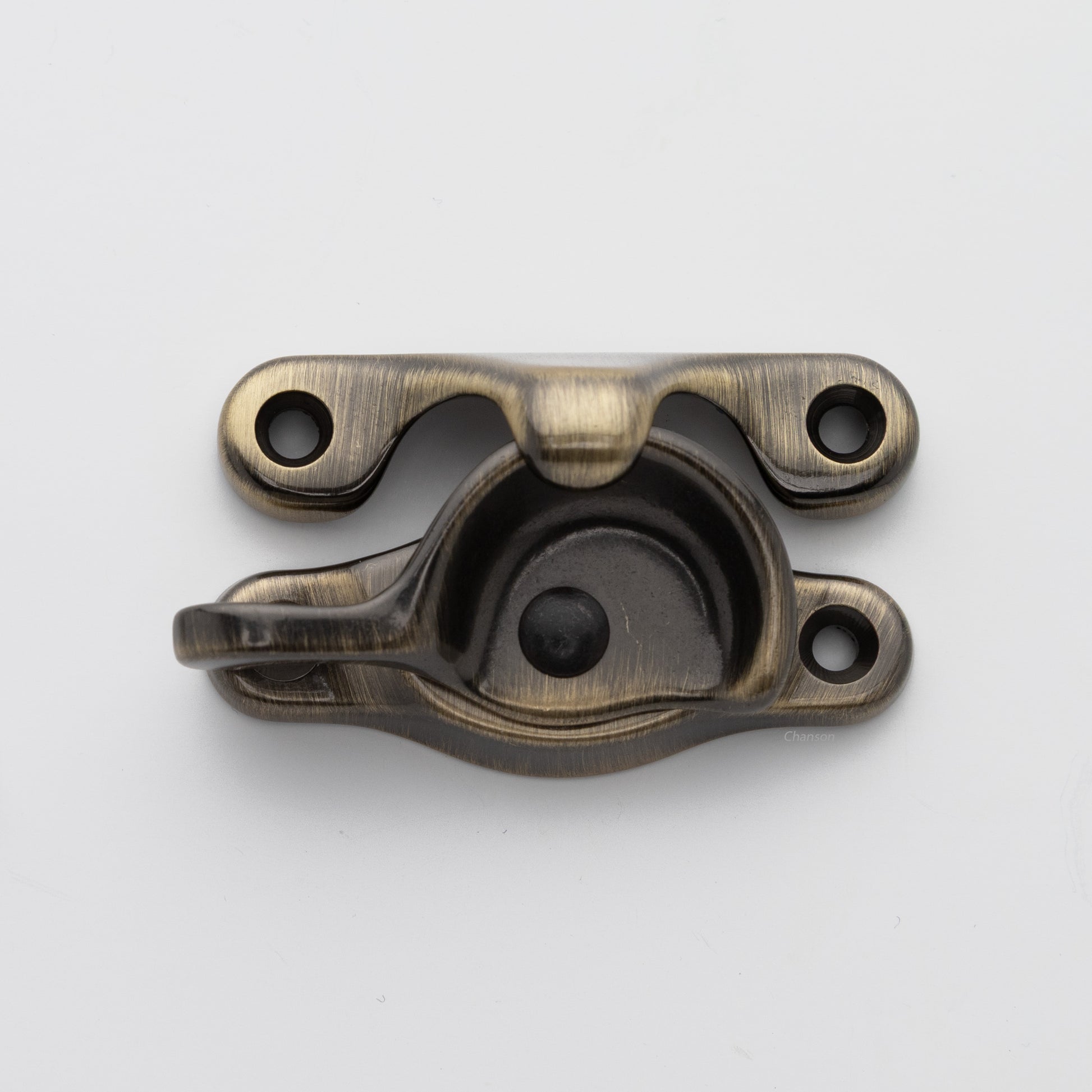 Classic or traditional solid brass sash catch or sash window lock with hook style keeper and crescent shape in antique brass US5 finish