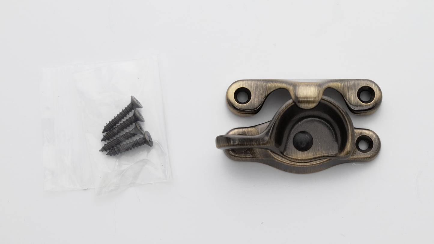 Solid brass sash window catch, regular size with finish matching screws in antique brass US5 finish