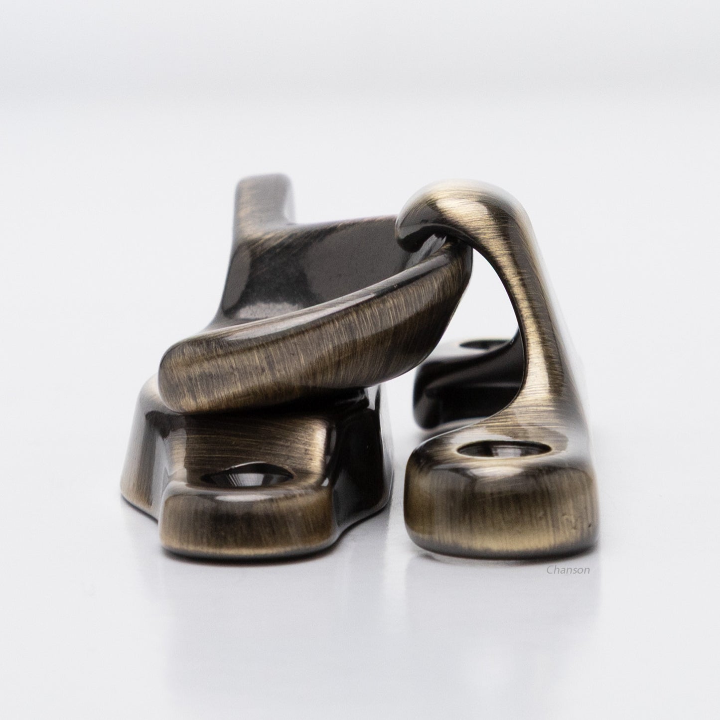 Side view of solid brass sash catch, which shows latch engaging with hook strike or keeper. finish is antique brass US5