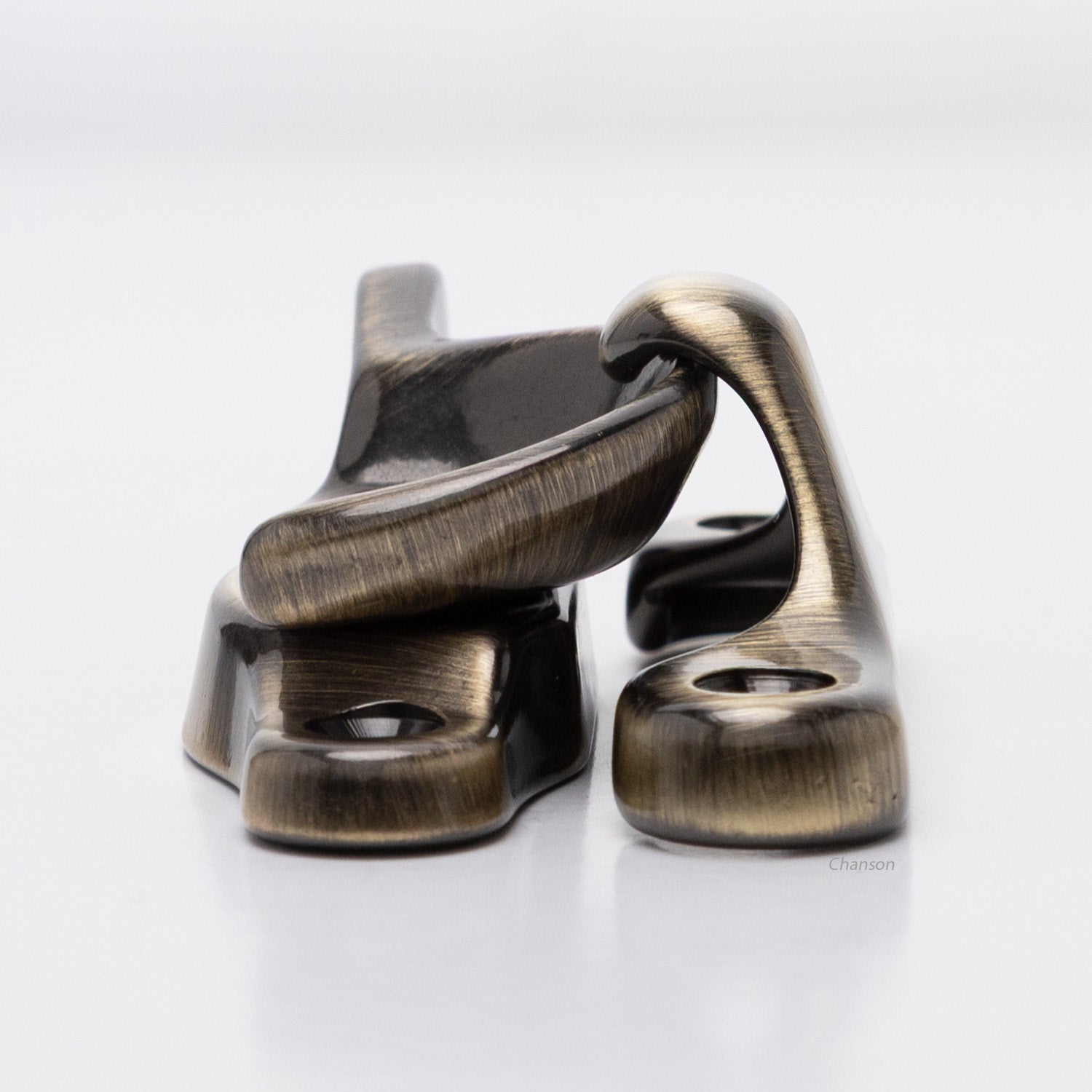 Side view of solid brass sash catch, which shows latch engaging with hook strike or keeper. finish is antique brass US5