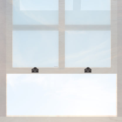 A wooden sash window with a pair of chanson hardware solid brass sash lifts that have a hook type design and an oil rubbed bronze finish 