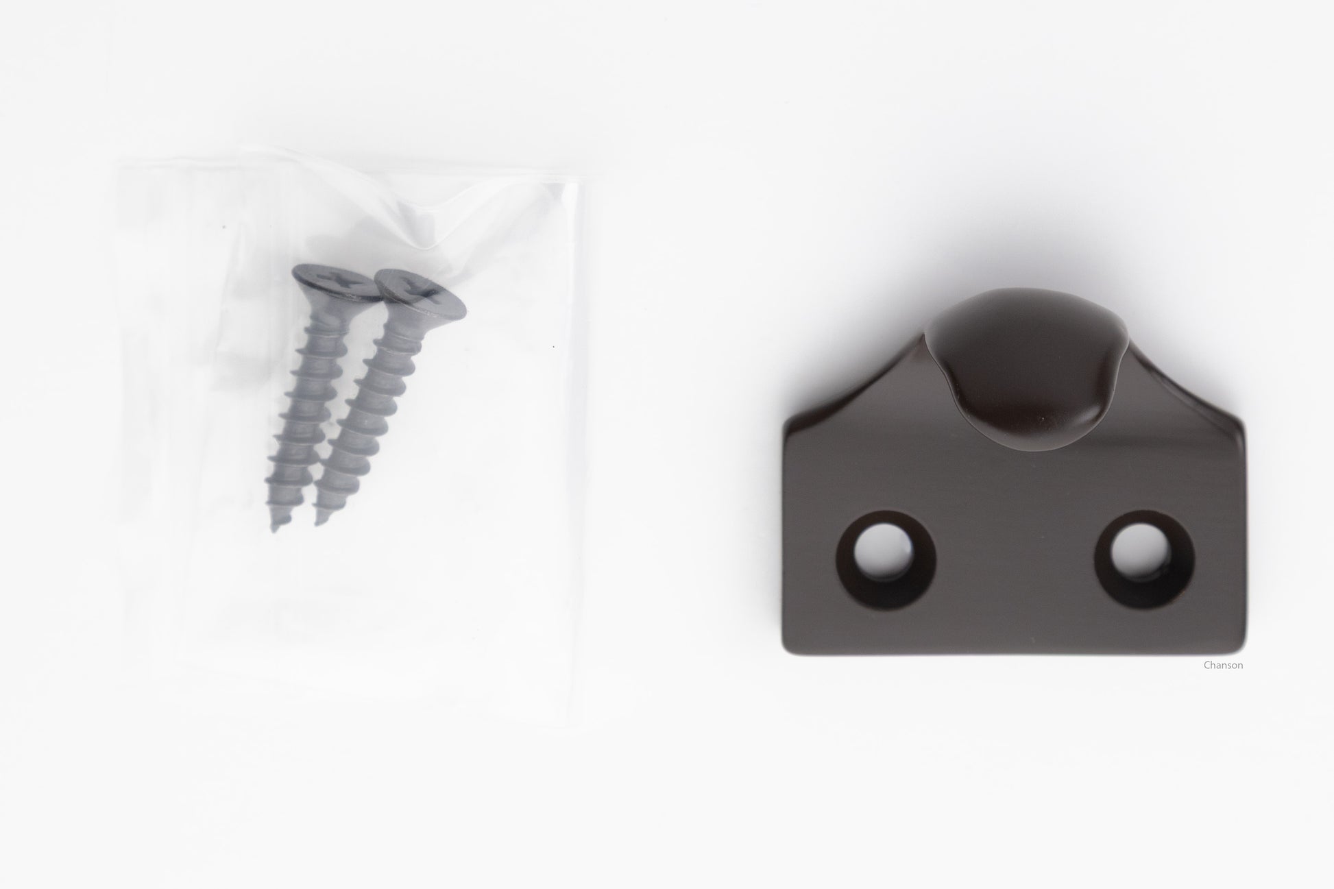 A classic traditional simple solid brass hook type sash window lift in oil rubbed bronze US10B finish, along with finish matching screws