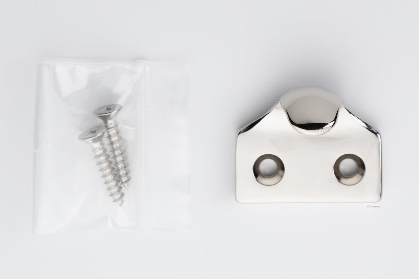 A classic traditional simple solid brass hook type sash window lift in polished nickel US14 finish, along with finish matching screws